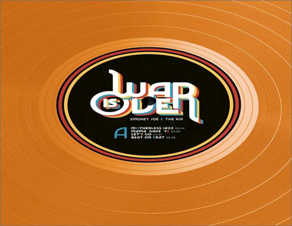 Macaron du vinyle War is Over sur disque orange, sillons visibles